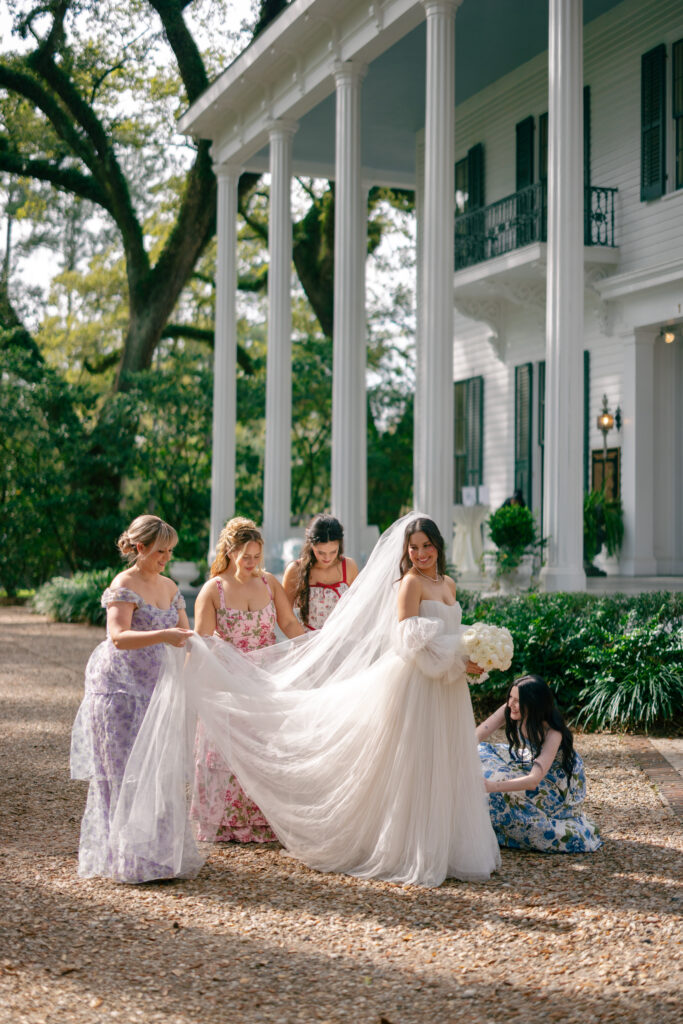 Bridesmaids Helping with Dress